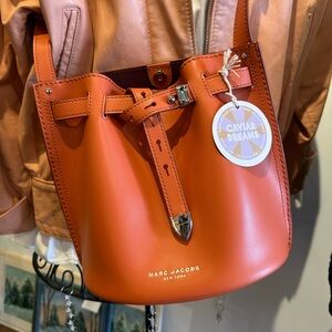 Marc Jacob’s New York Orange genuine leather bucket bag.